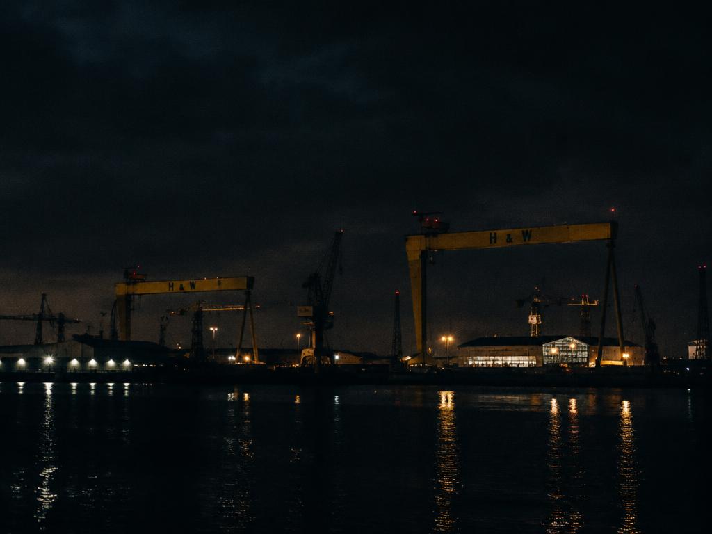 Placeholder — Belfast at night with harbour cranes